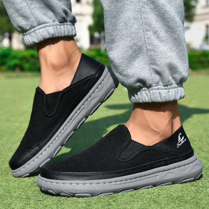 Black quilted slip-ons for men, offering superior comfort and lightweight feel