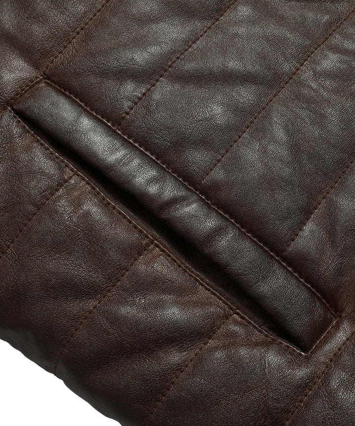 Lifestyle image of the men's faux leather quilted jacket paired with a t-shirt