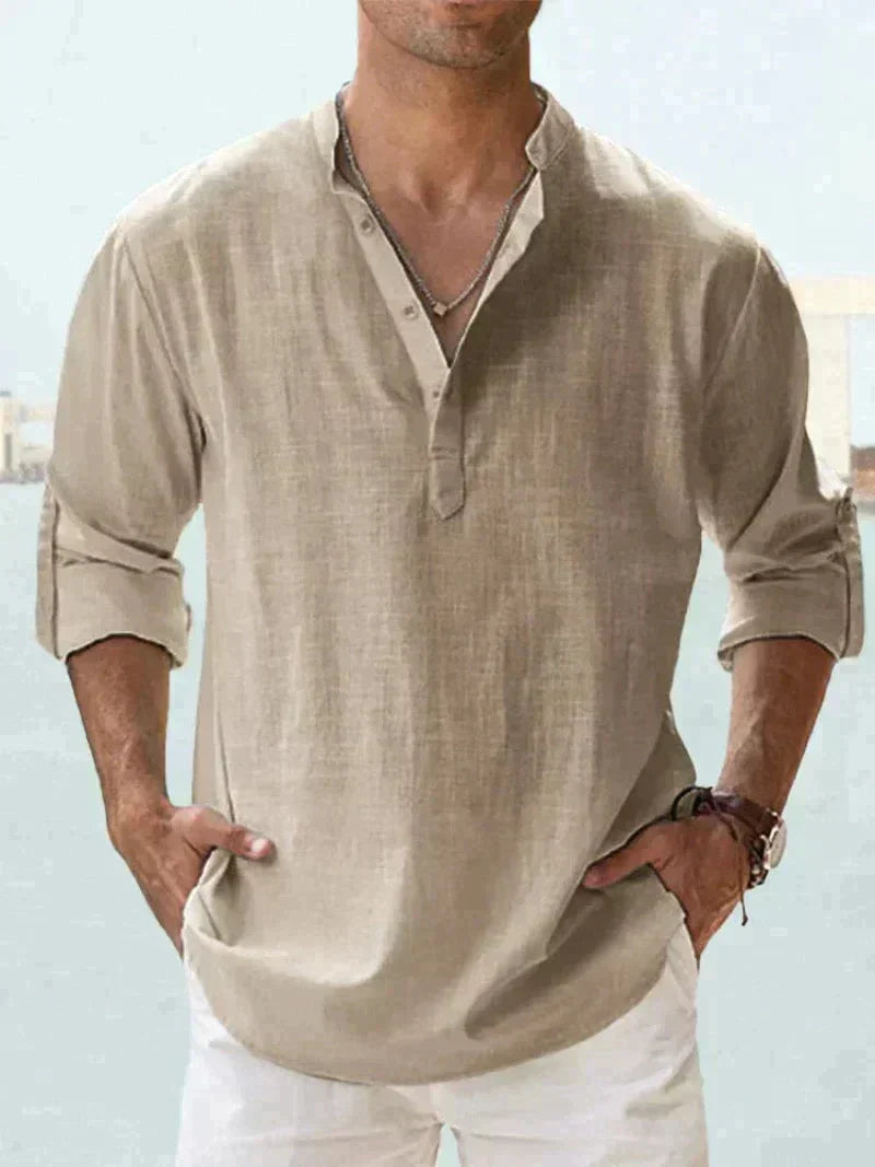 Relaxed fit men's button-down summer shirt with long sleeves, perfect for a comfortable, casual vacation look.