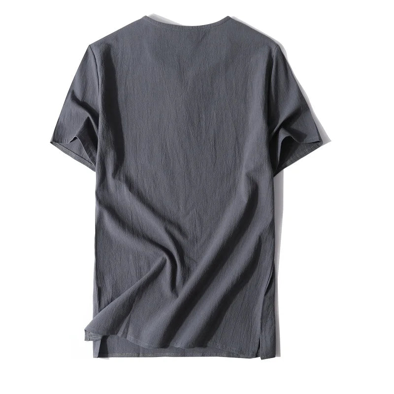 Man modeling a relaxed fit button-neck t-shirt, highlighting its versatile and comfortable everyday appeal.