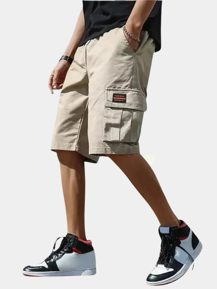 Men's relaxed fit cargo shorts in a neutral color, perfect for summer adventures and casual outdoor activities.