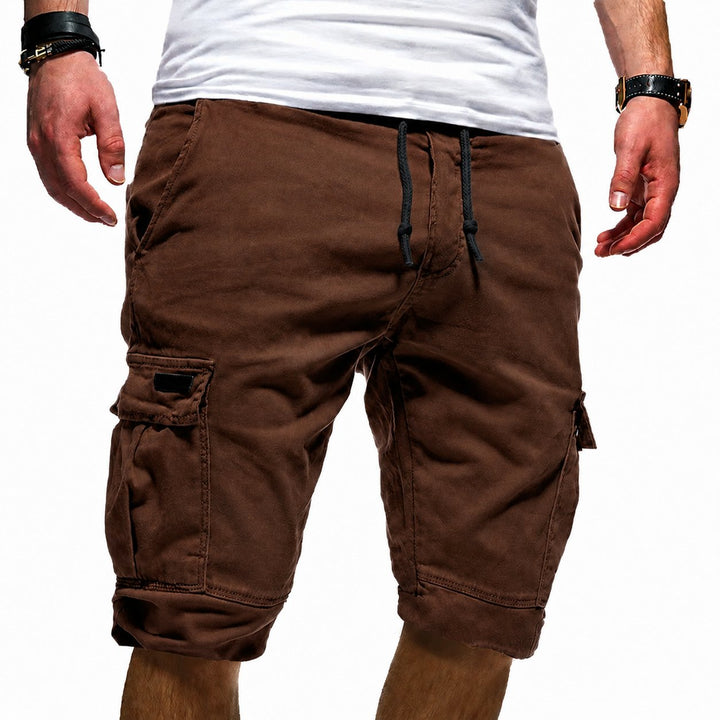 Close-up of practical multi-pockets on men's relaxed fit cargo walking shorts, summer outdoor essential.