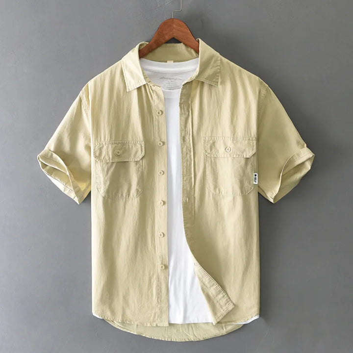 Men's relaxed fit casual shirt, short sleeve button-up with chest pockets, ideal for everyday summer wear.