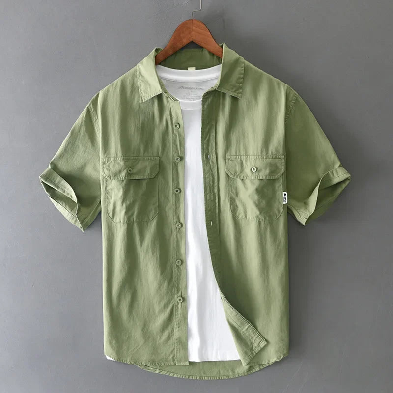 Comfy men's short sleeve casual shirt, relaxed fit, button-up with stylish chest pockets for modern style.