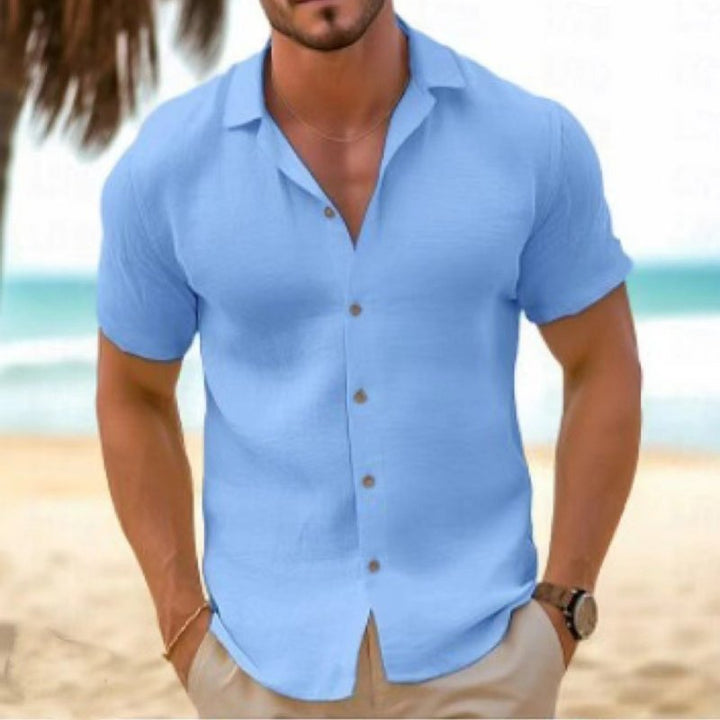 Men's relaxed fit button-up short sleeve collared shirt, essential for beachwear, travel, summer.