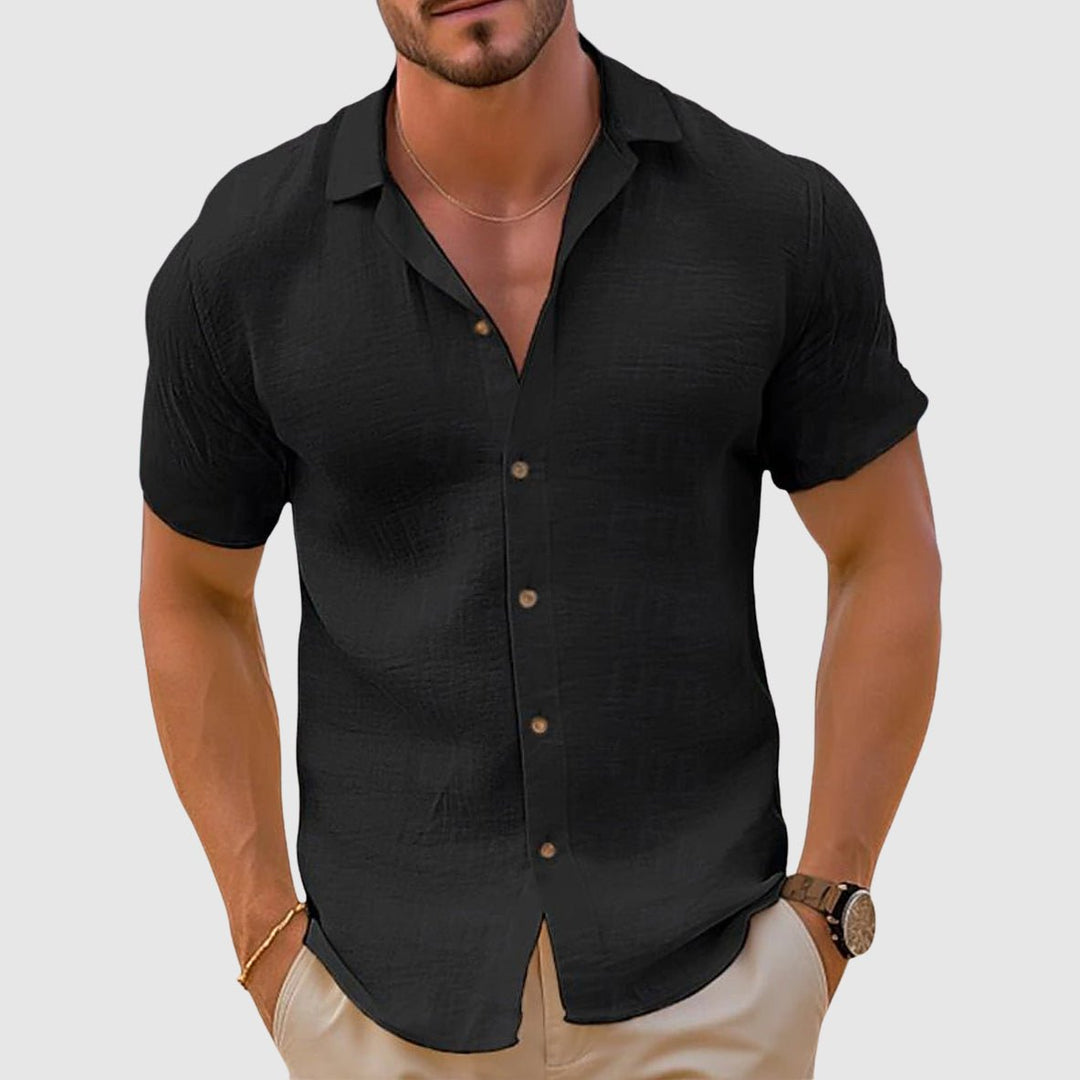 Comfortable men's relaxed fit button-up shirt with collar & short sleeves for everyday summer style.