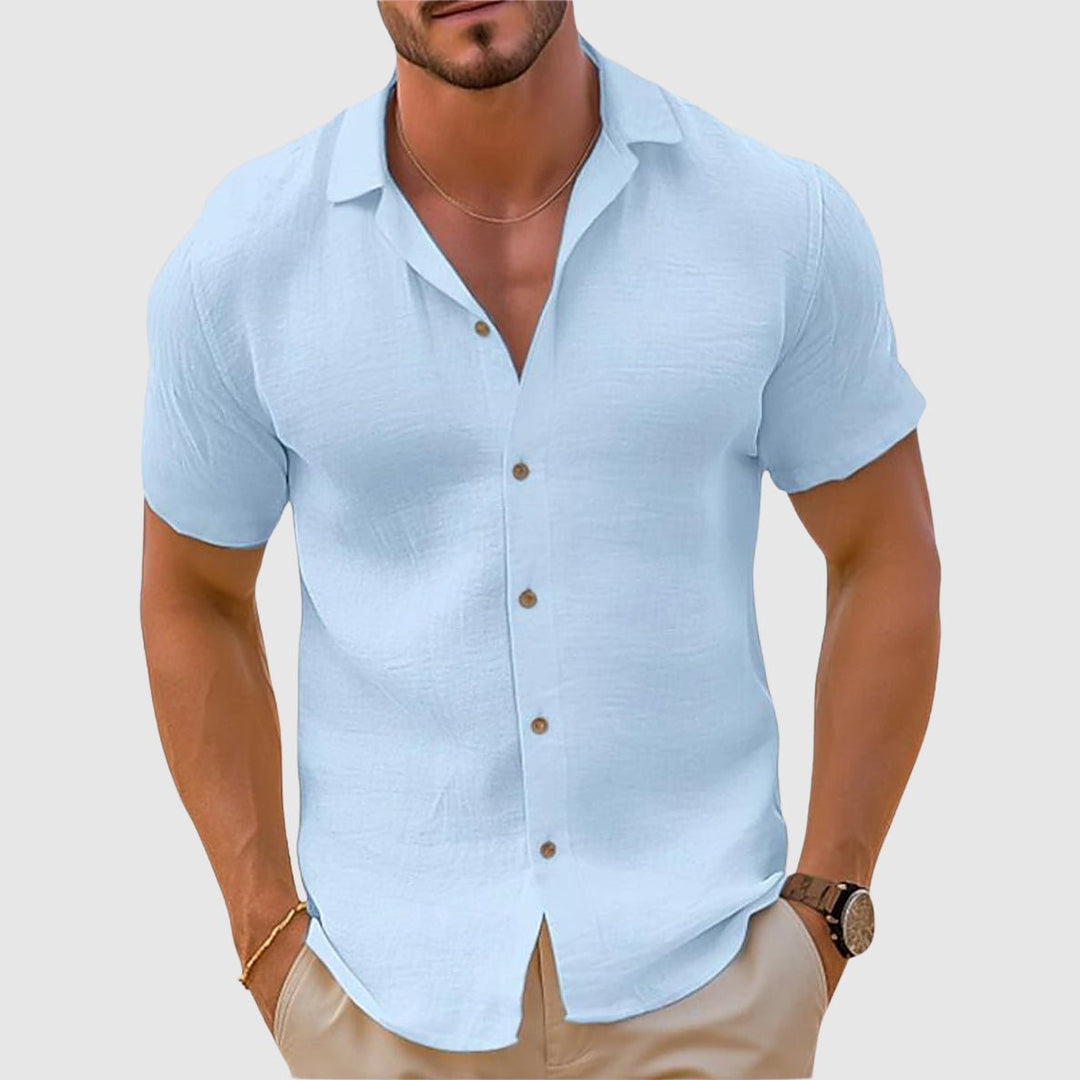 Casual men's short sleeve collared shirt with a relaxed fit, perfect button-up for summer vacation style.