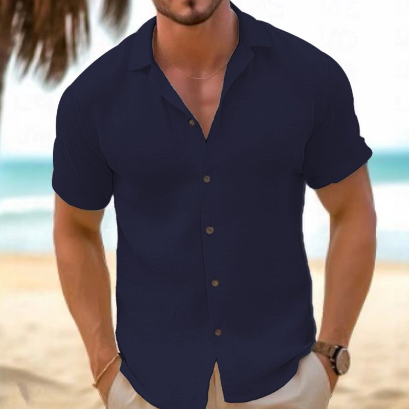 Breathable men's relaxed fit short sleeve collared button-up shirt for ultimate summer comfort.