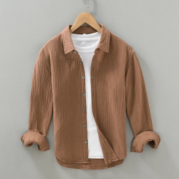 Men's versatile cotton button-down shirt, relaxed fit, shown unbuttoned over a t-shirt.