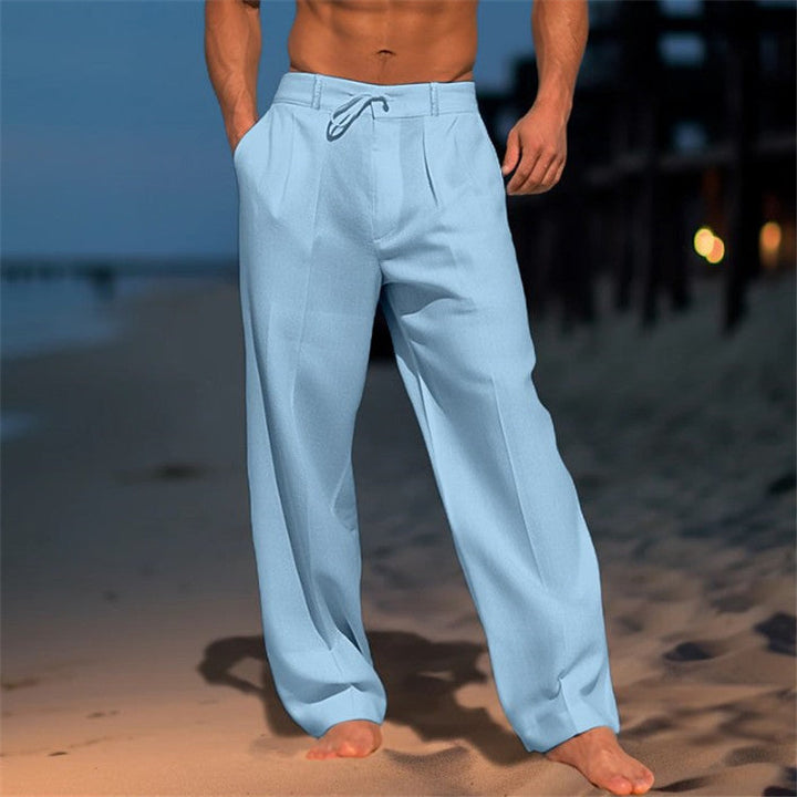 Stack of folded men's relaxed fit drawstring pants in various spring colors, comfortable and stylish