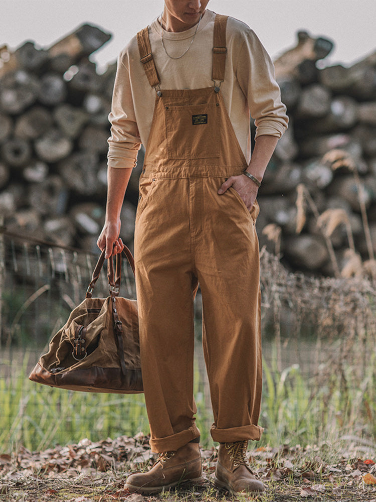 Men's relaxed fit khaki overalls for ultimate comfort. Features adjustable straps & utility bib pockets, perfect for casual wear.