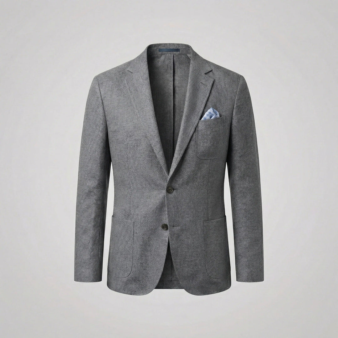 Man in a buttoned relaxed fit lightweight blazer, exuding smart casual summer elegance. Casual jacket.