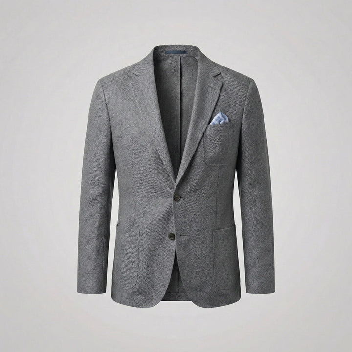 Man in a buttoned relaxed fit lightweight blazer, exuding smart casual summer elegance. Casual jacket.