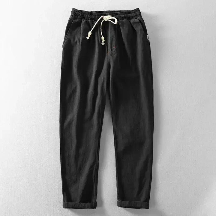Men's relaxed fit linen jogger pants in light beige, perfect for casual summer comfort with drawstring waist