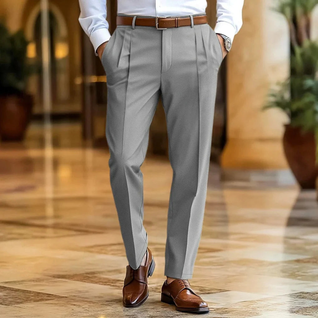Stylish men's tailored summer trousers with a relaxed fit & pleats. Breathable lightweight fabric for versatile smart casual looks.