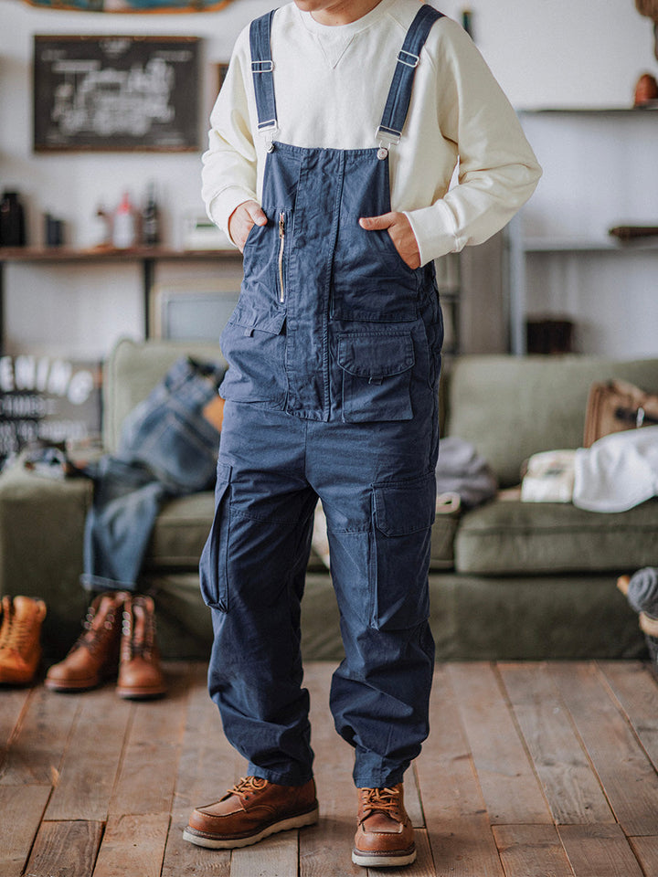 Stylish men's utility bib overalls with cargo pockets and adjustable straps for workwear fashion.