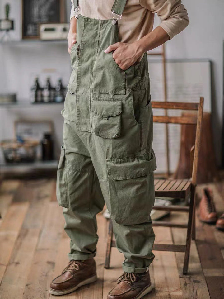 Durable men's relaxed fit utility jumpsuit, ideal for active wear, outdoor activities, and workwear.