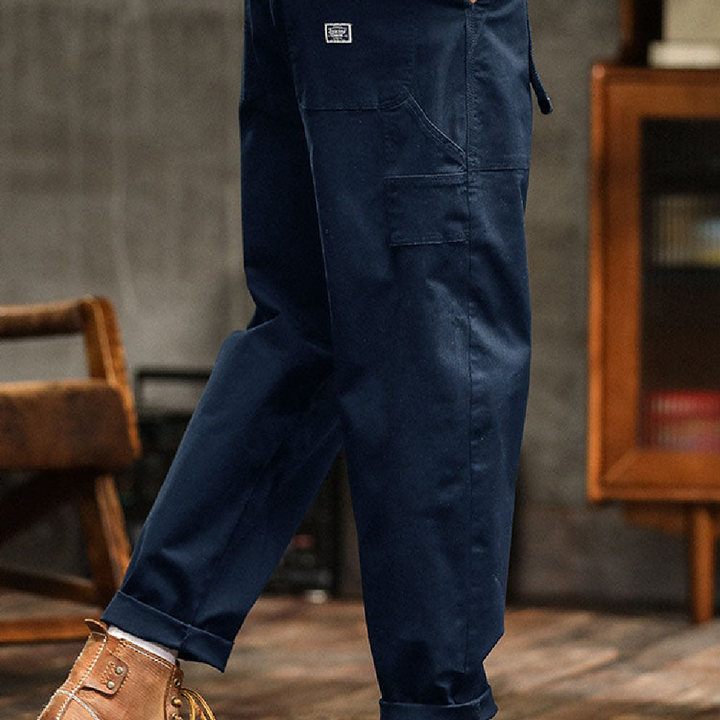 Stylish khaki men's relaxed fit utility pants, combining comfort with practical design.