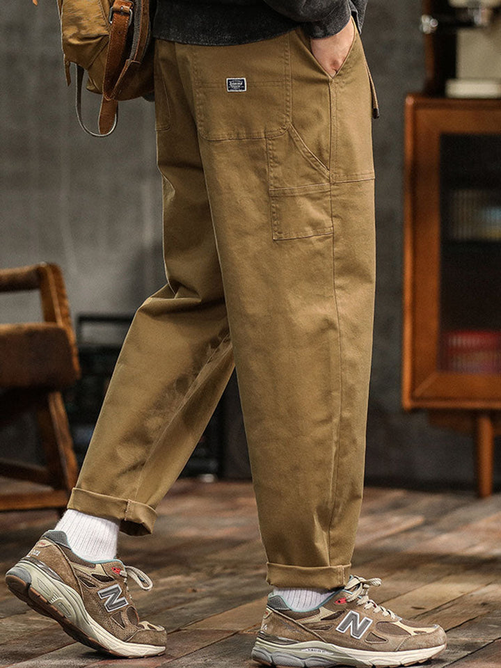 Black men's relaxed fit cargo pants, a go-to option for durable & comfortable everyday wear.