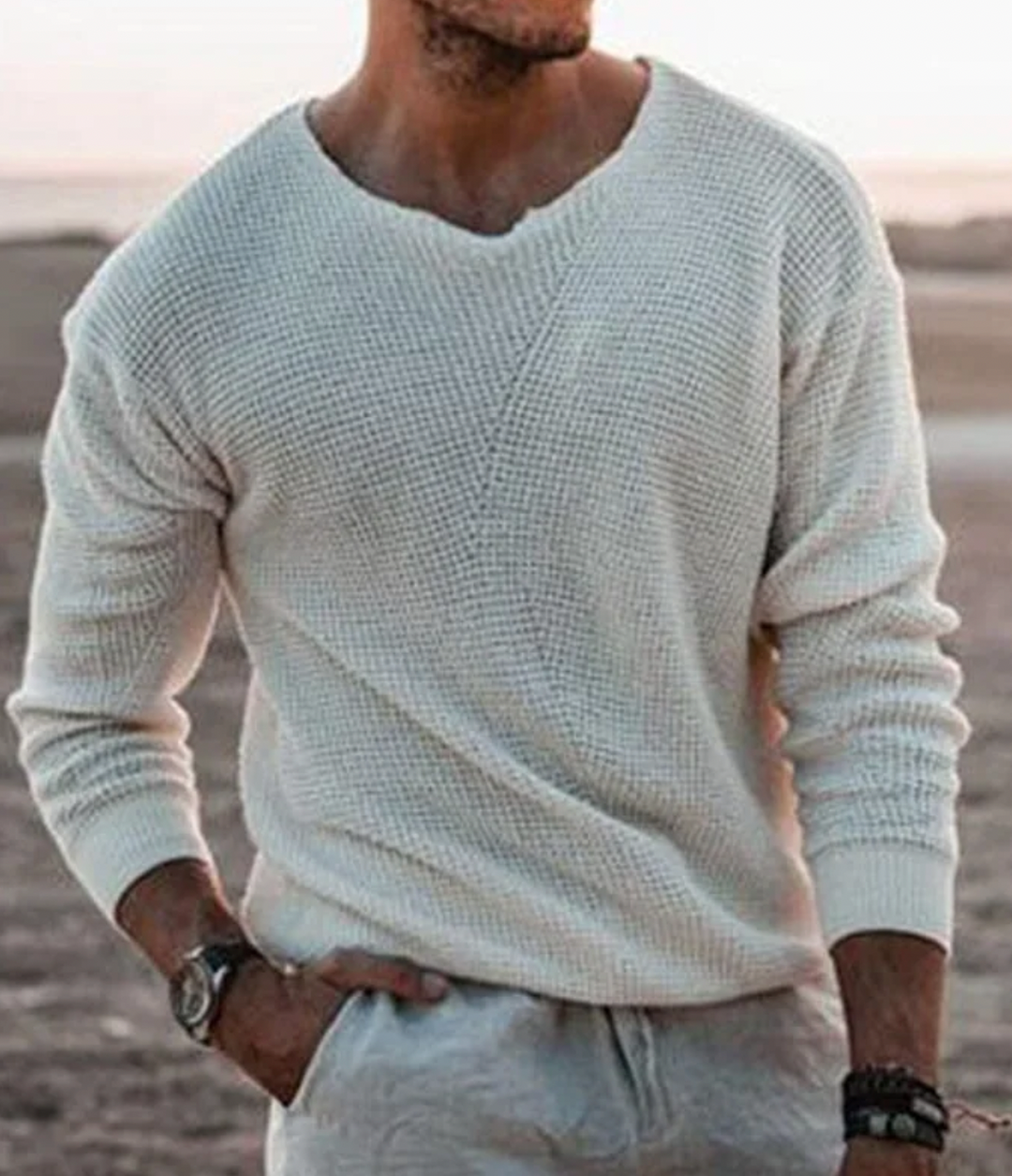 Casual men's long-sleeve waffle-knit sweater. Relaxed fit v-neck pullover, comfortable for everyday wear.