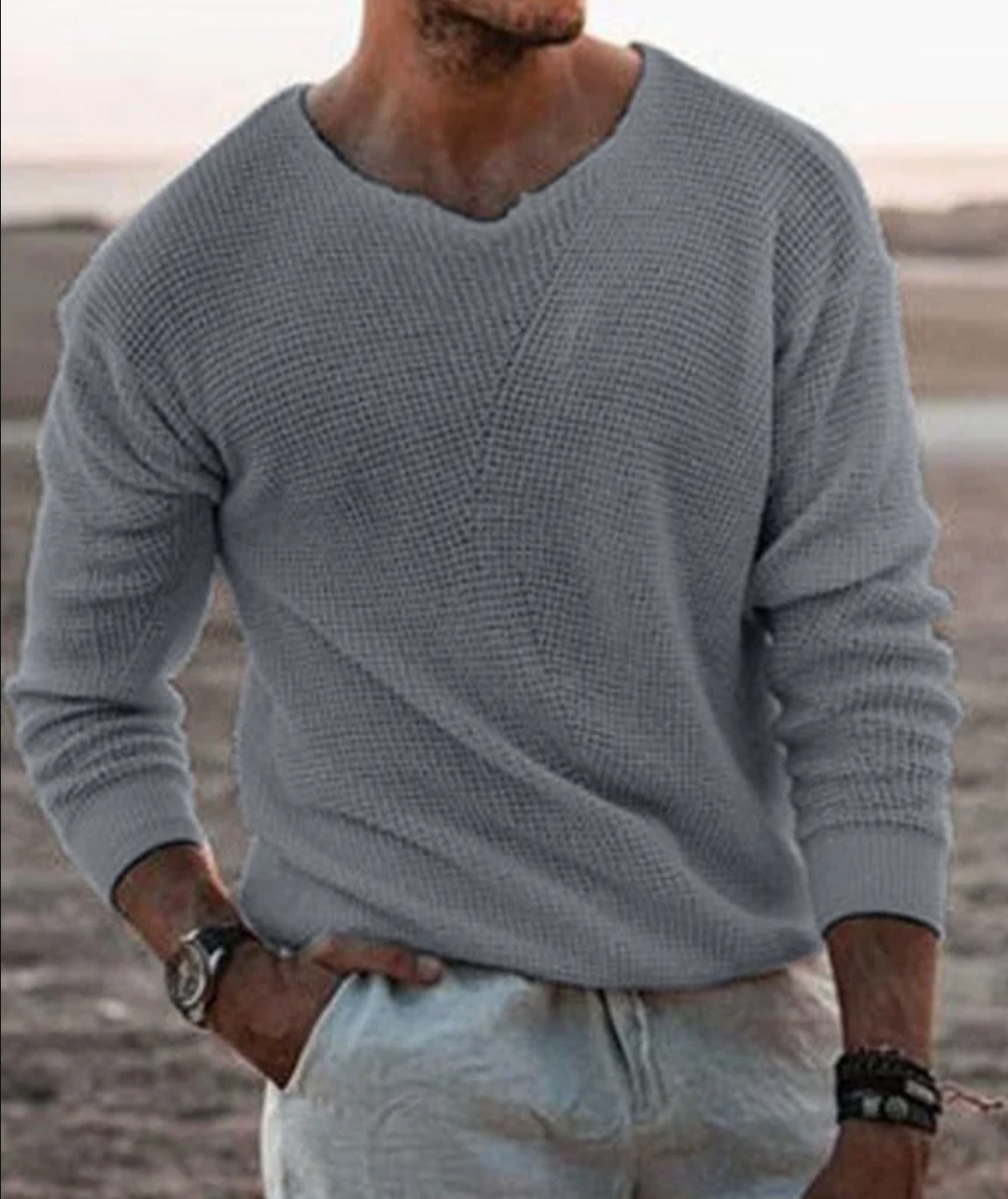Cozy men's waffle-knit sweater. Relaxed fit, long-sleeve v-neck, versatile for winter style.