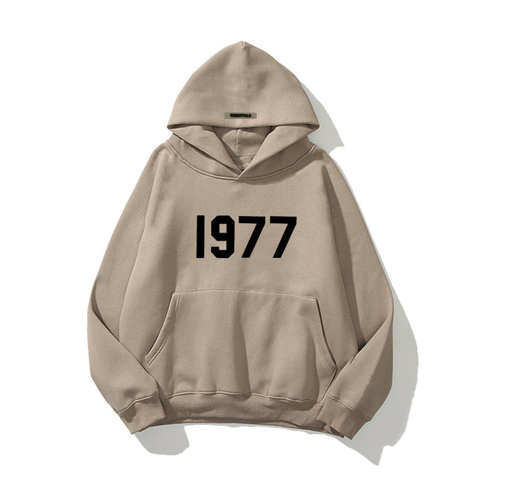 Vintage 1977 print on men's raglan sleeve hoodie, perfect for retro streetwear and urban fashion.