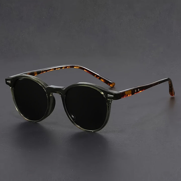 Sleek men's round frame sunglasses in solid black. Lightweight & classic retro shades for stylish men.