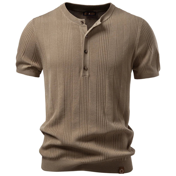 Model wearing a men's ribbed henley top, showcasing a comfortable fit and effortless, modern everyday style.