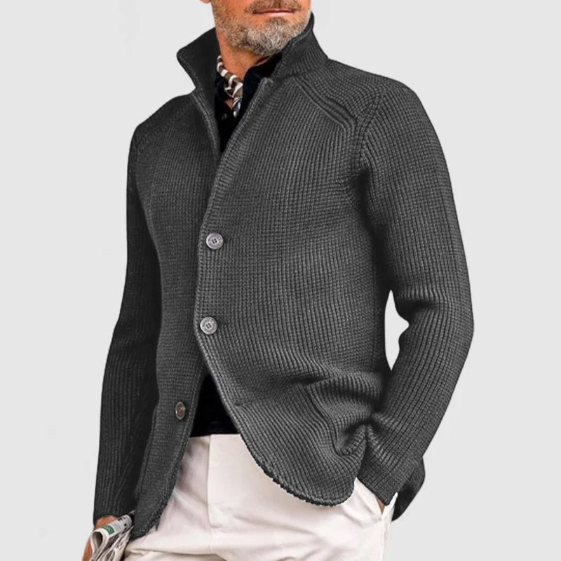 Men's button-front ribbed knit cardigan featuring practical front pockets and an elegant shawl collar design.