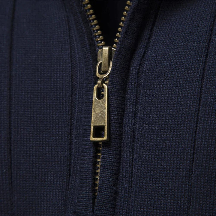 Close-up of men's ribbed mock neck half zip sweater, showcasing texture, long sleeves, and quality.
