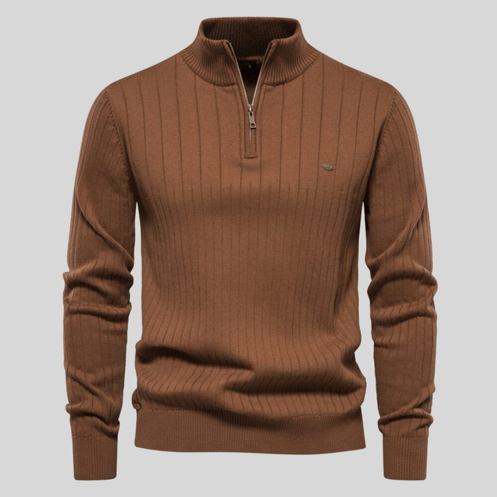 Man wearing stylish ribbed mock neck half zip sweater, ideal for casual outings or office wear.