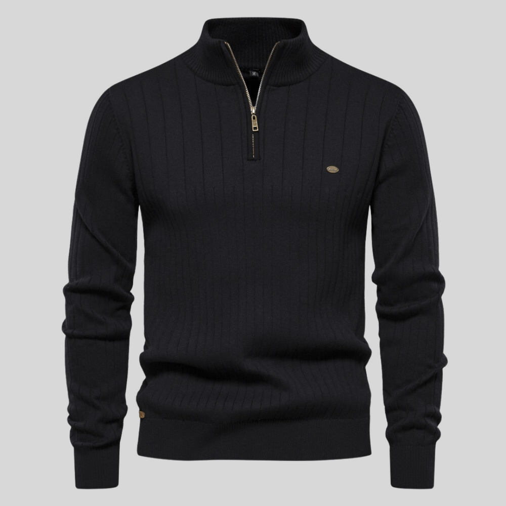 Detail of men's long sleeve ribbed mock neck half zip sweater, highlighting the ribbed texture and mock neck.