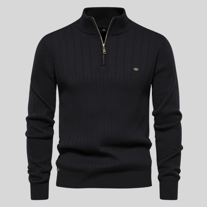 Detail of men's long sleeve ribbed mock neck half zip sweater, highlighting the ribbed texture and mock neck.