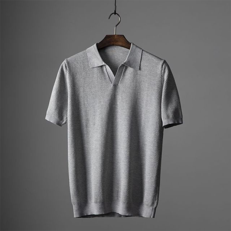 Stylish men's textured polo shirt with geometric pattern, perfect for summer and versatile wear.