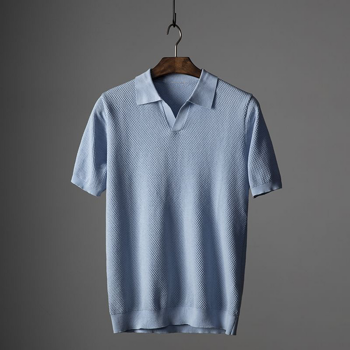 Casual men's short sleeve knit polo, featuring a subtle texture. Comfortable and fashionable summer top.