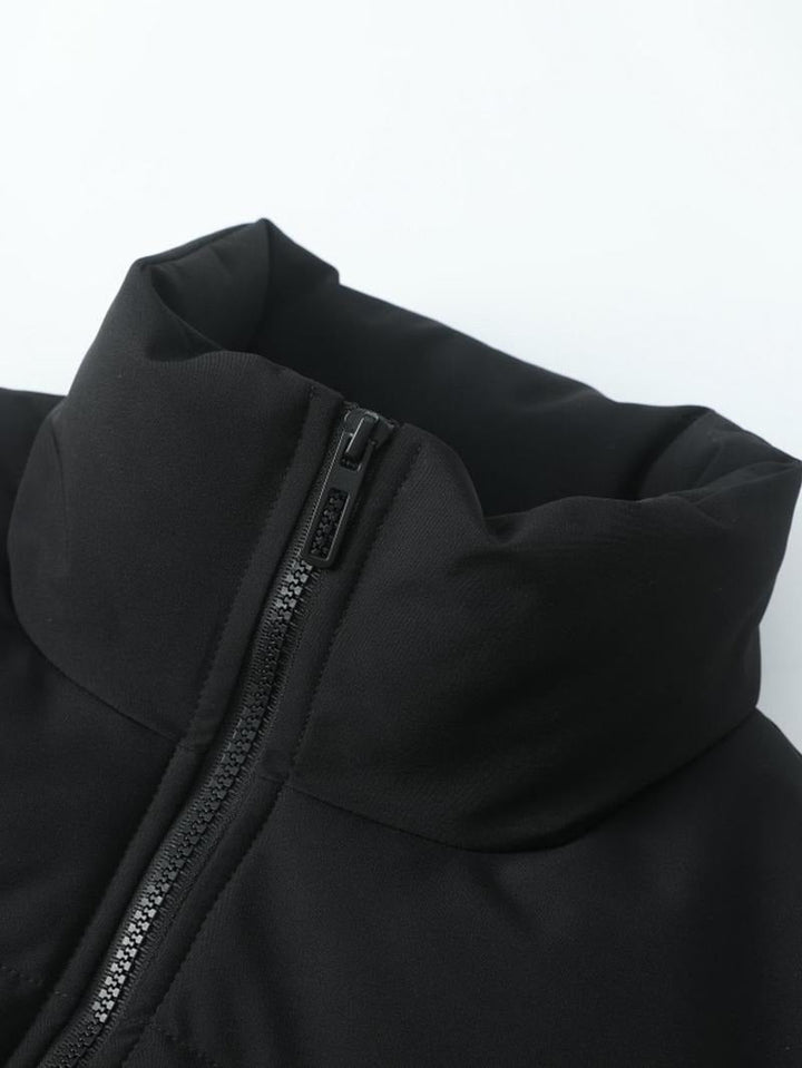 Casual men's black puffer coat. Insulated polyester jacket. Sleek and warm winter wear.