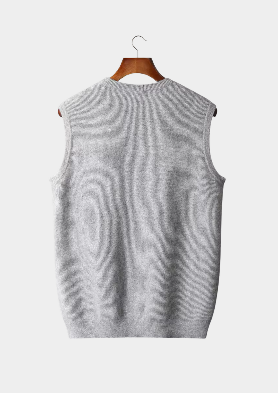 Beige men's sleeveless crew neck vest for versatile layering. A comfortable cotton blend wardrobe essential.