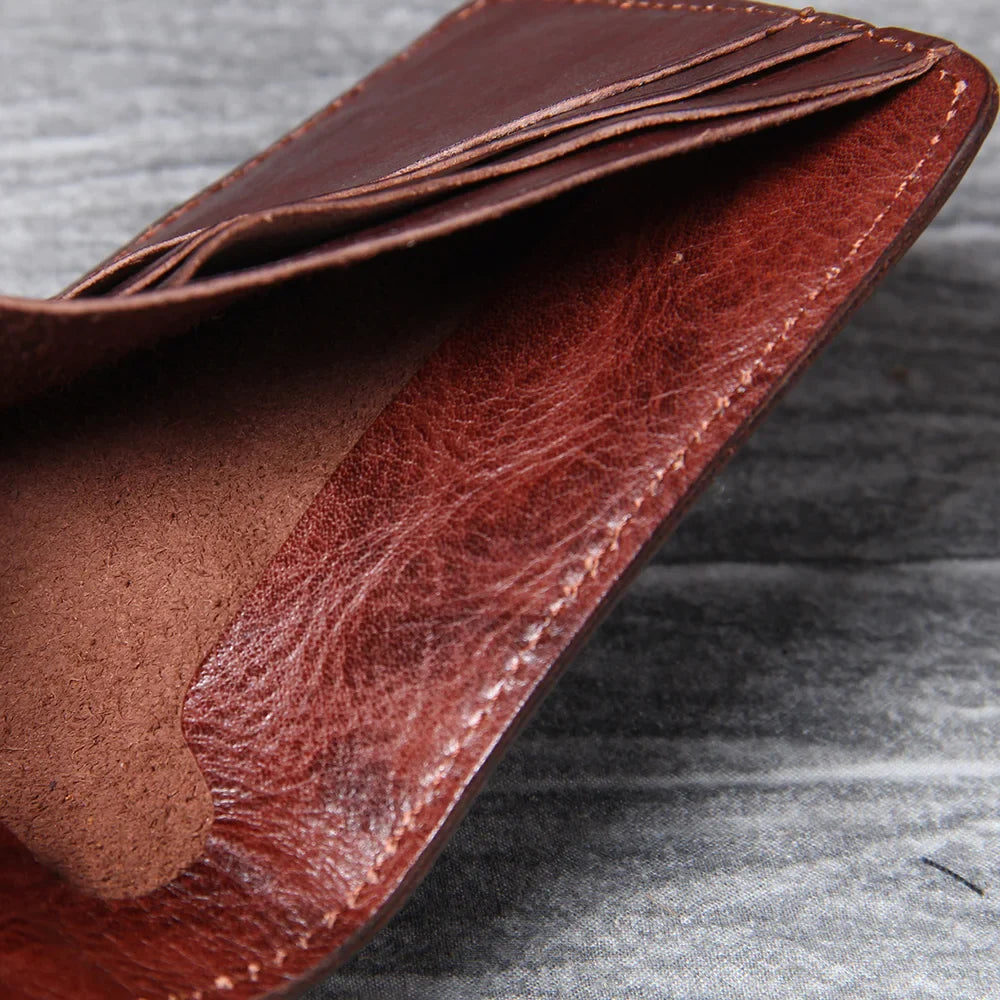 Men's bifold wallet in tan leather, featuring a compact and slim profile.