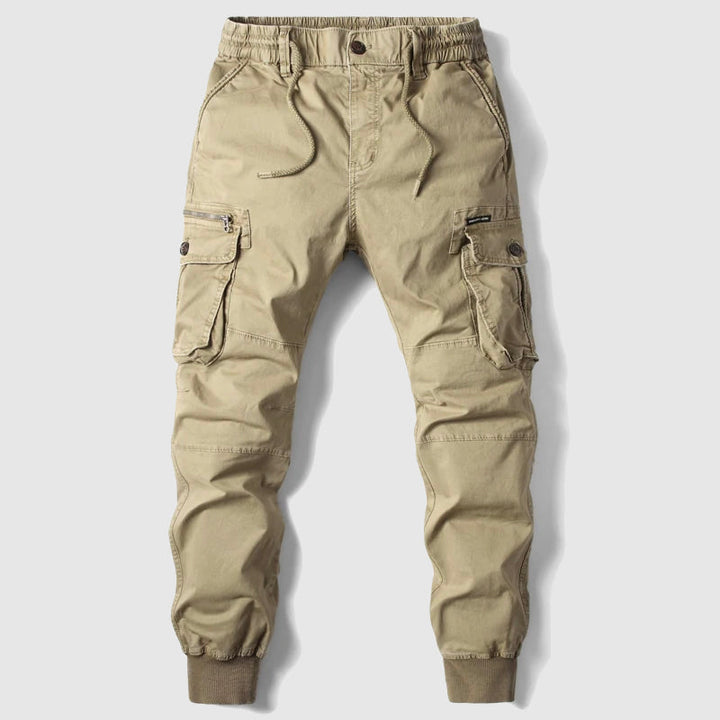 Black men's slim fit cargo joggers with multiple utility pockets, elastic cuffs, and adjustable drawstring for comfort.