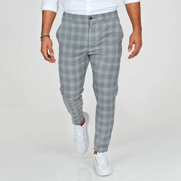 Tapered men's slim fit checked trousers, ankle-length for a contemporary, sharp style.