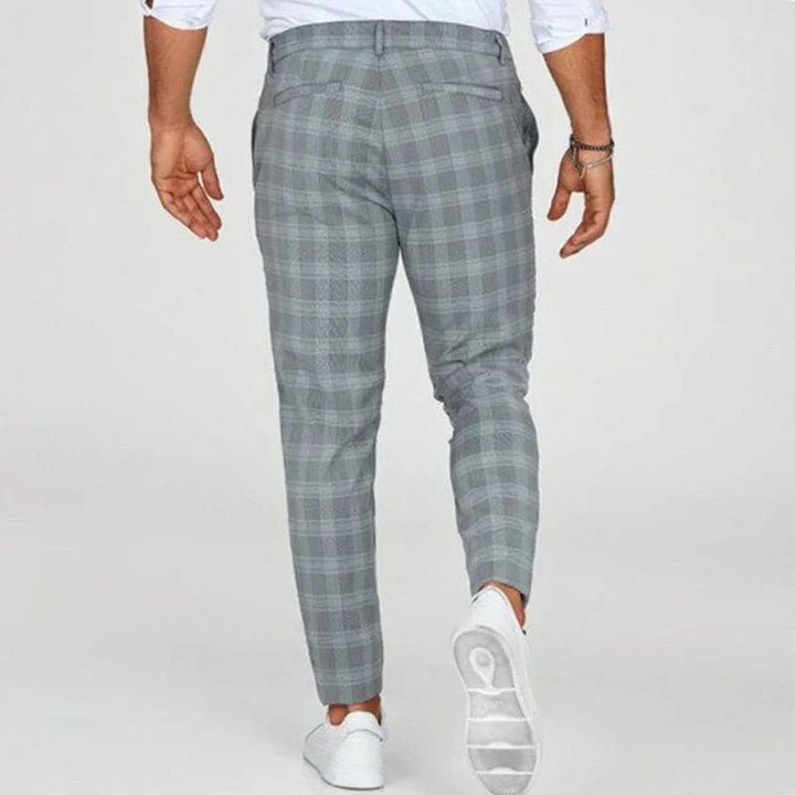 Versatile men's cropped checked pants, slim fit design ideal for various smart casual outfits.