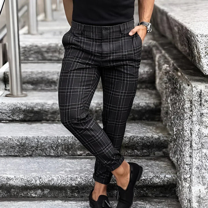 Comfortable men's slim fit cropped checked pants, offering a sharp, modern ankle-length style.