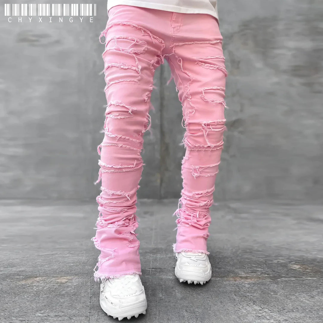Casual men's slim fit ripped jeans featuring distressed denim & fashionable tears. Ideal for everyday urban street style.