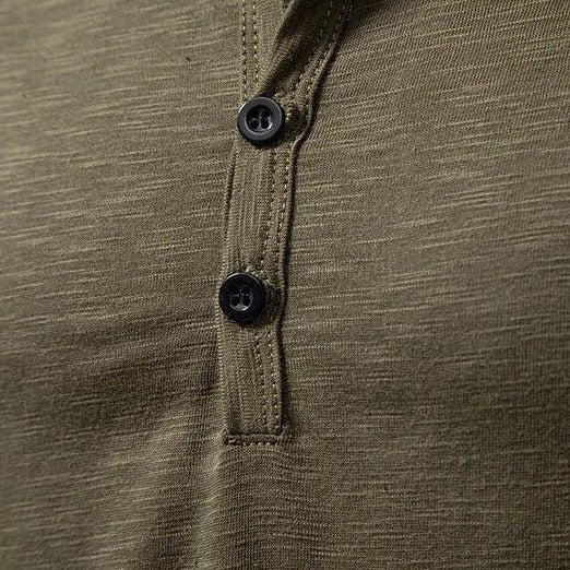 Modern men's apparel: slim fit henley shirt with long sleeves & button detail.