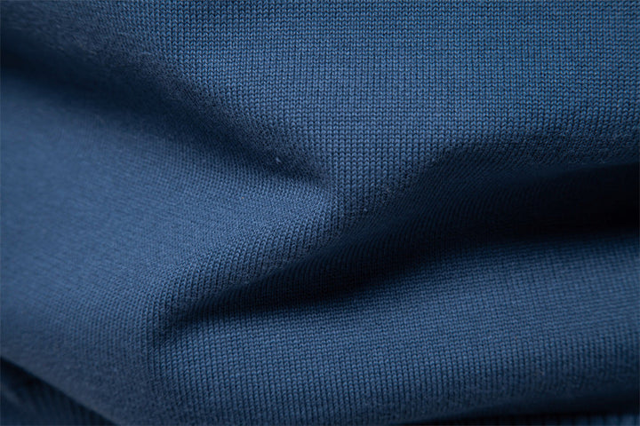 Back view of a men's slim fit ribbed V-neck sweater, showing seamless design