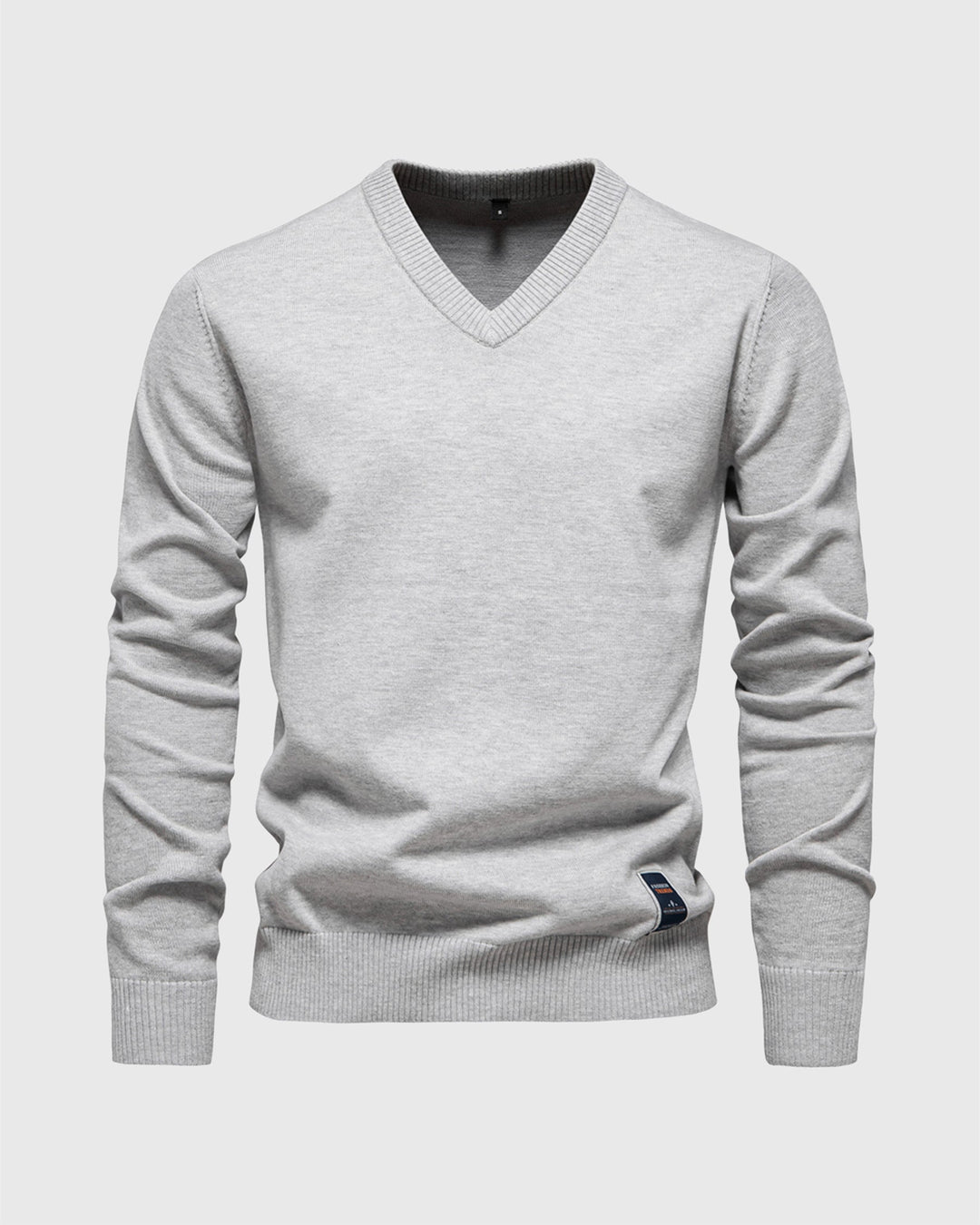 Close-up of the V-neckline and ribbed detailing on a men's cotton blend pullover