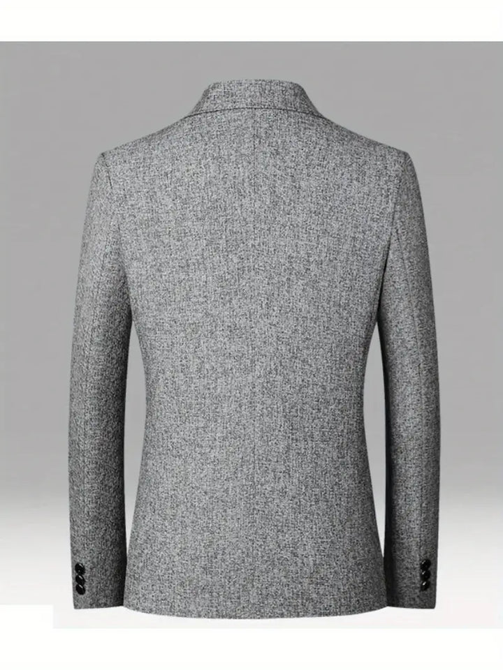 Modern men's blazer in a slim fit, ideal for spring fashion, offering versatile smart casual style effortlessly.
