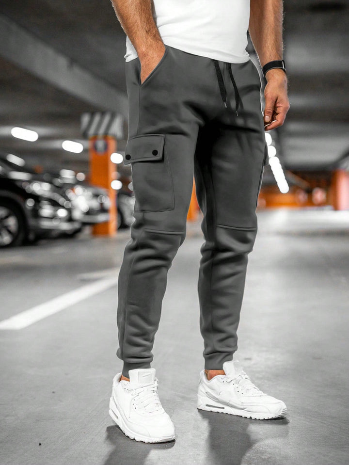 Comfortable men's casual trousers, slim fit joggers featuring an adjustable waist.
