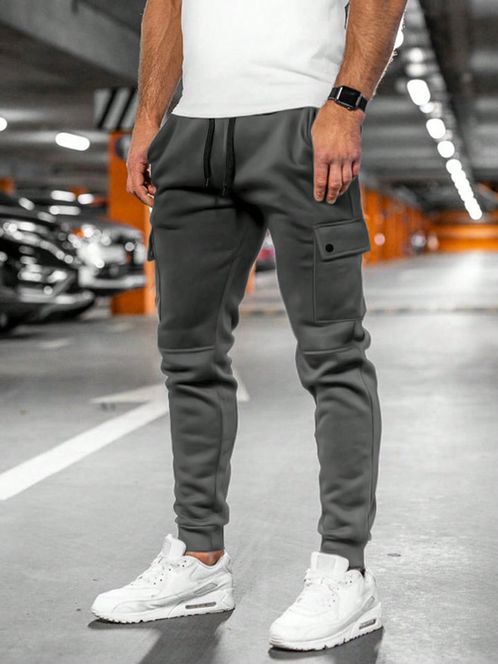 Versatile men's jogger pants, slim-fit style, ideal for casual wear & comfort.