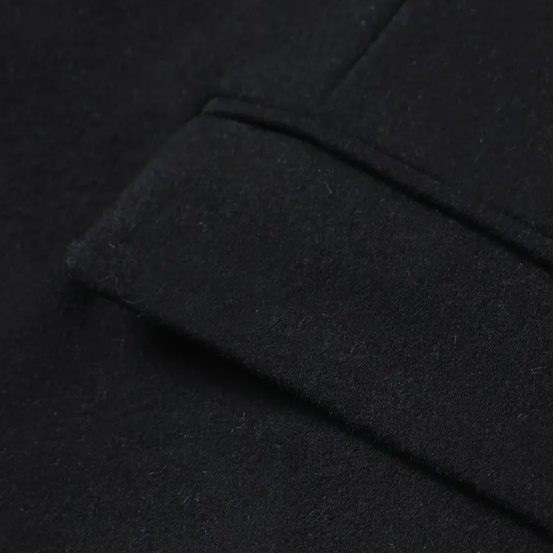 Fashionable men's slim fit trench coat. A long winter jacket with a stand collar, offering a modern, elegant look.